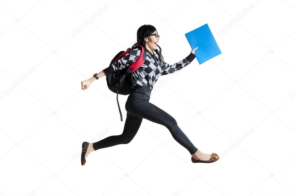 Casual female student running 