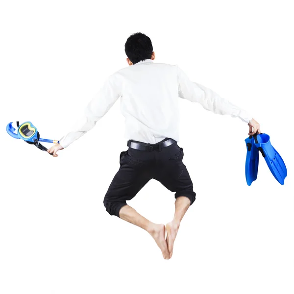 Businessman with snorkeling gear jumping — Stock Photo, Image