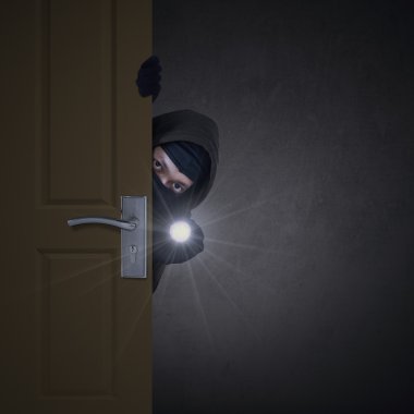 Thief sneaking through door clipart