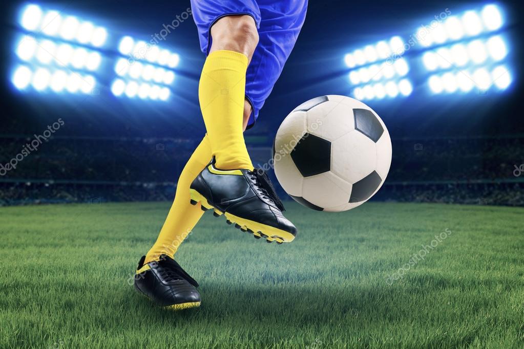 Soccer player kicking the ball Stock Photo by ©realinemedia 48013831