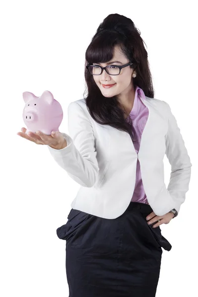 Businesswoman holds piggybank for savings — Stock Photo, Image