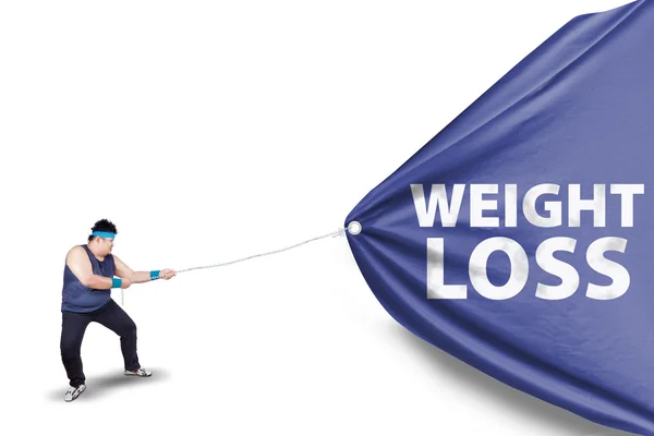Gordo puxando um banner de perda de peso 2 — Fotografia de Stock