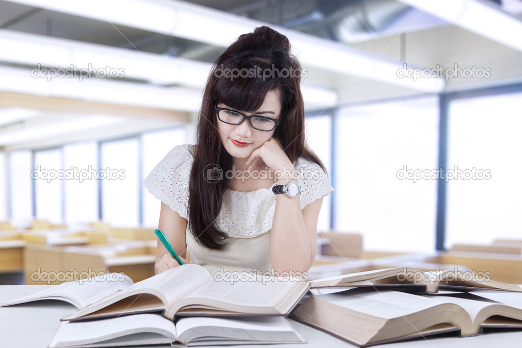 Beautiful student doing homework