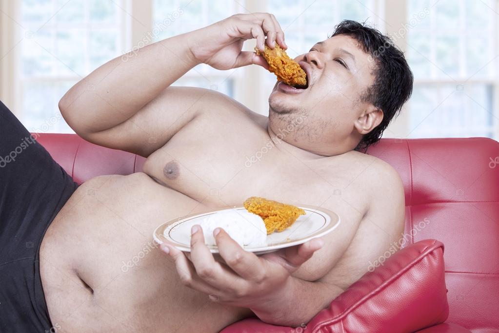 Fat man eats fast food 1