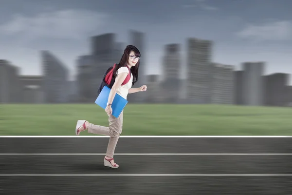 Student running on tracks 1 — Stock Photo, Image