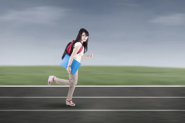 Student running on tracks — Stock Photo, Image