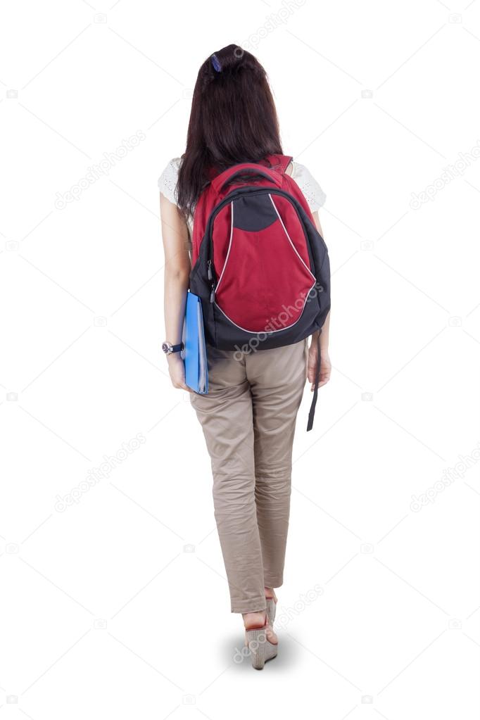 Rearview student walking on white background