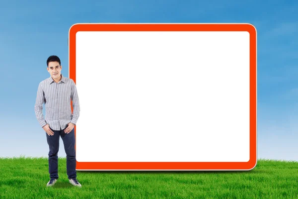 Asian man and empty billboard — Stock Photo, Image
