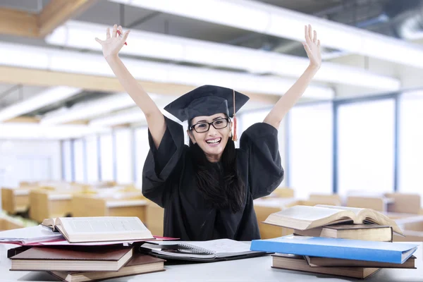 Excited bachelor studying in library 1 — Stock Photo, Image
