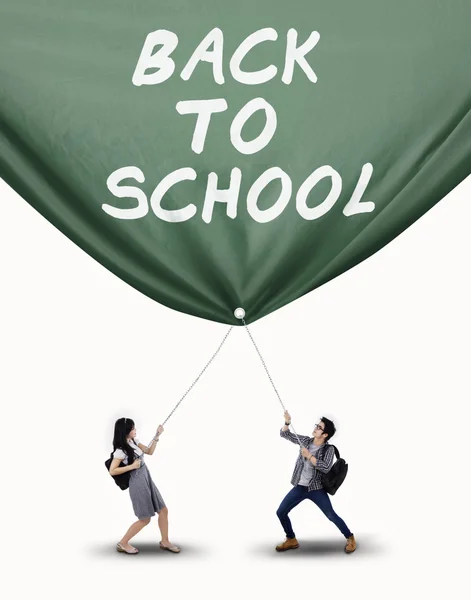 Vysokoškolský student tahání banner izolované — Stock fotografie