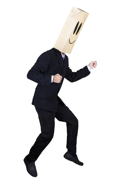 Anonymous businessman with running gesture — Stock Photo, Image