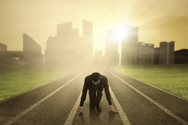 Businessman on race track — Stock Photo, Image