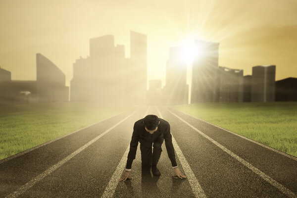 Businessman on race track