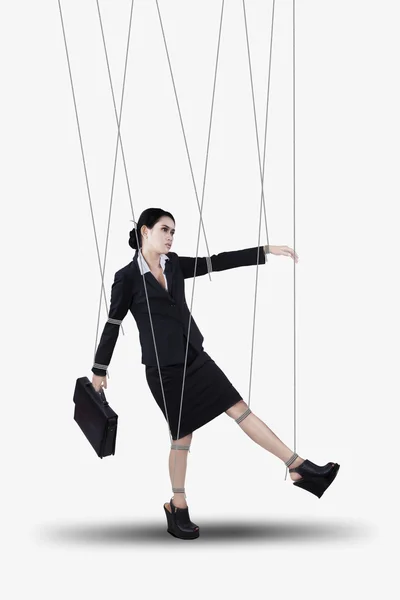 Businesswoman hanging on strings — Stock Photo, Image