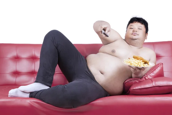 Zwaarlijvige man eet fast-food 2 — Stockfoto