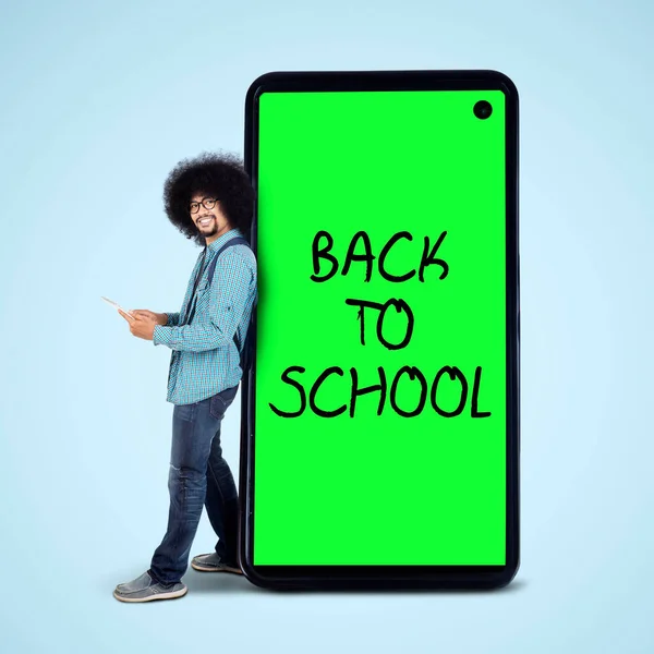 Male Afro Student Using Digital Tablet While Standing Back School — Stock Photo, Image