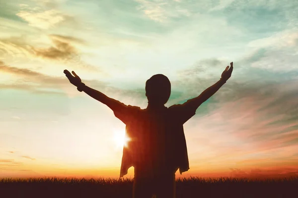 Silhouette Young Man Raising Hands While Standing Park Shot Dusk — Stock Photo, Image