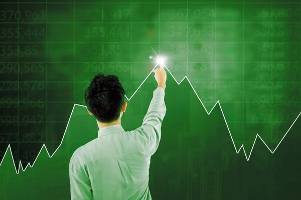 サイバー空間における証券取引所の背景との財務グラフに触れるビジネスマンのバックビュー — ストック写真