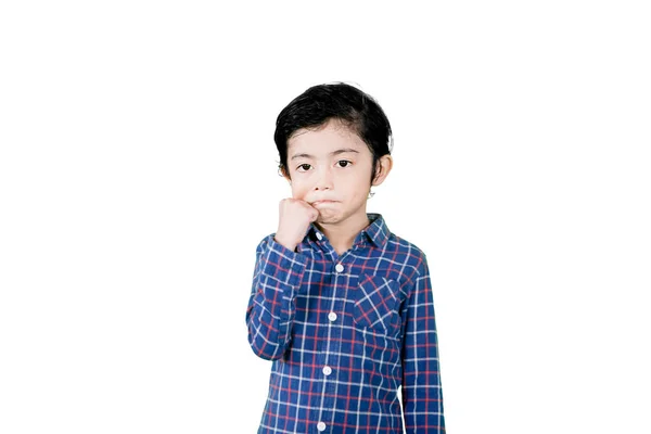 Cute Little Boy Pinching His Cheek While Standing Studio Isolated — Stock Fotó