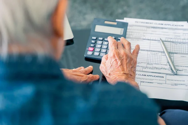 Aged Man Calculating His Savings Retirement Form Table While Sitting — ストック写真