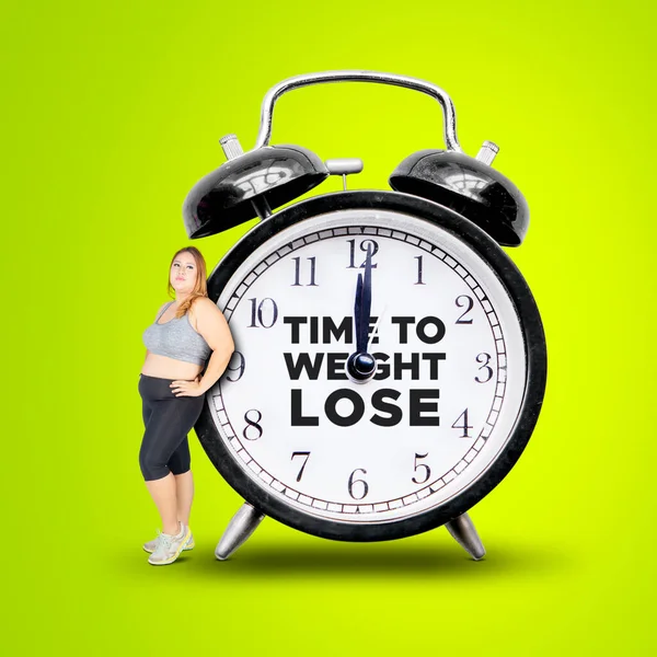 Fat Woman Leaning Alarm Clock Text Time Weight Lose While — Stockfoto