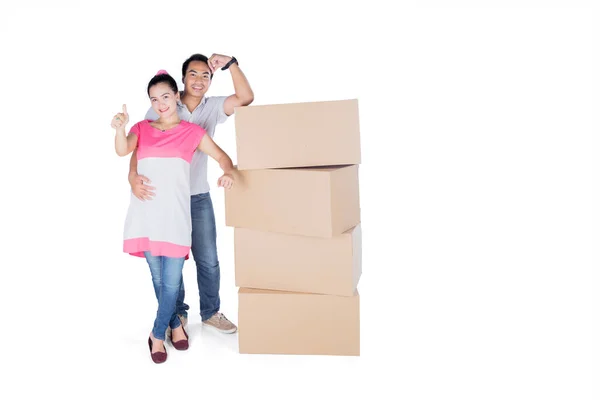 Young Couple Showing Thumb While Standing Pile Cardboard Box Studio — Stock Photo, Image