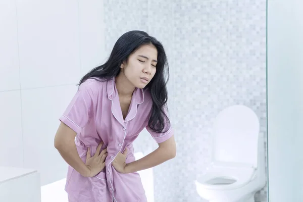 Portrait Young Woman Suffering Stomach Ache While Standing Bathroom Shot — Fotografia de Stock