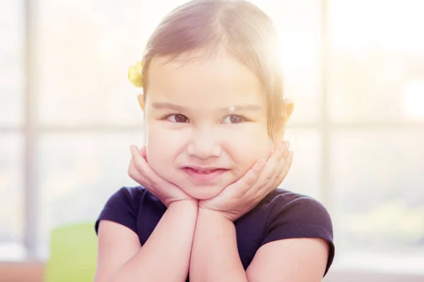 Close Cute Little Girl Smiling Camera Hands Prop Her Chin — стоковое фото