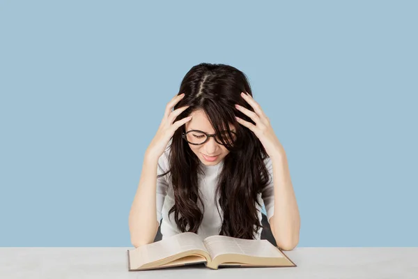 Female Student Looks Depressed While Studying Book Studio Gray Background — Stockfoto