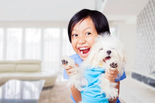 Excited Little Girl Playing Maltese Dog While Standing Living Room — Fotografia de Stock