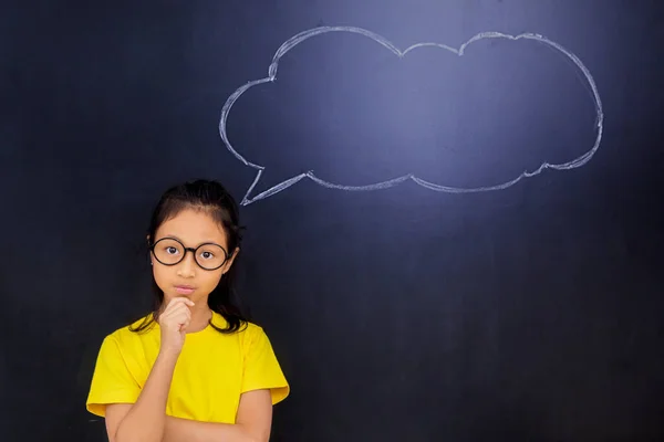 Female Elementary School Student Thinking Idea While Standing Classroom Empty — Stockfoto