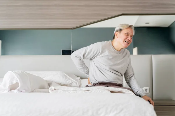 Old Man Having Backache Waking While Sitting Bed Shot Home — Stockfoto
