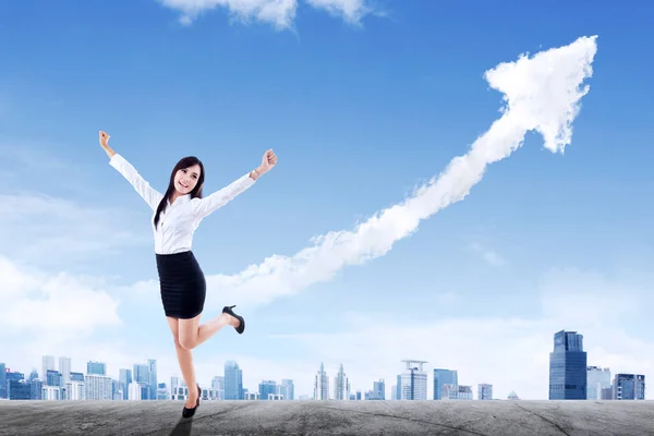 Happy Businesswoman Expressing Success While Standing Rooftop Clouds Shaping Upward — Stockfoto