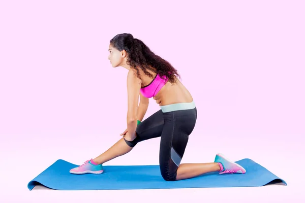 Side View Indian Woman Stretching Her Foot While Exercising Studio — Stockfoto