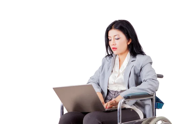 Disabled Businesswoman Sitting Wheelchair While Using Laptop Studio Isolated White — Stock Photo, Image