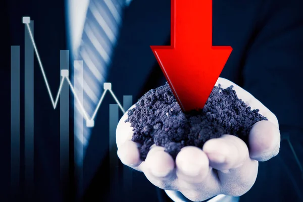 Close Businessman Hand Holding Soil Falling Arrow While Standing Declining — Stockfoto