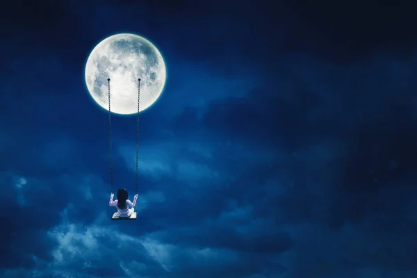 Rear View Little Girl Sitting Alone Swing While Hanging Moon — Foto Stock