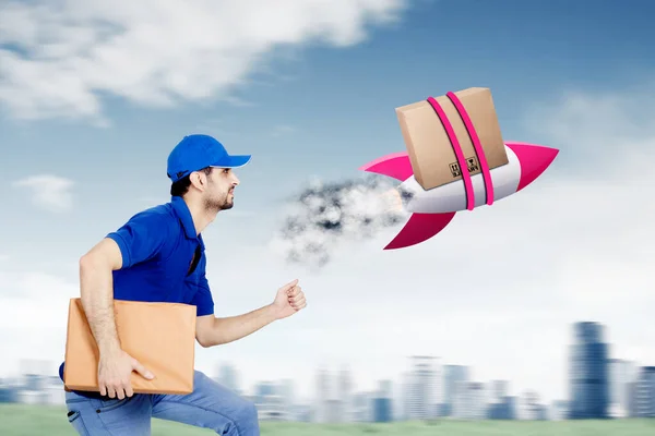 Male Courier Delivering Package Box More Faster Rocket While Running — Fotografia de Stock