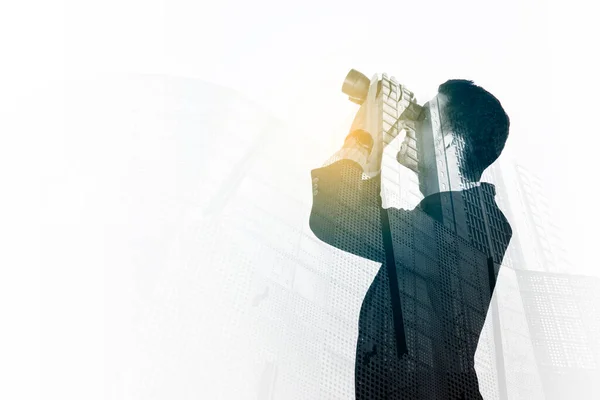 Double Exposure Male Manager Using Binoculars While Standing Modern Building — Stock Photo, Image