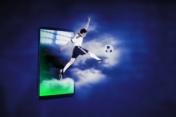 Soccer Player Jumping Out Cellphone Screen While Kicking Ball Cyberspace — Stockfoto