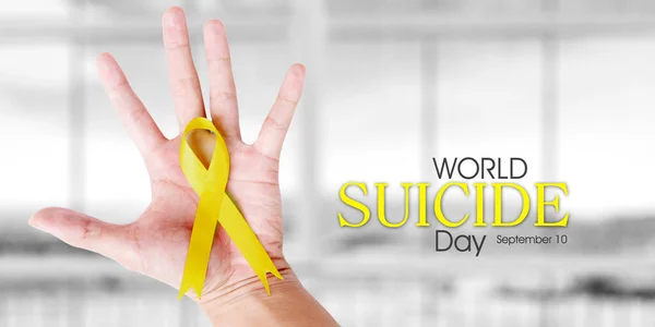 Close Man Hand Holding Yellow Ribbon World Suicide Day Text — Fotografia de Stock