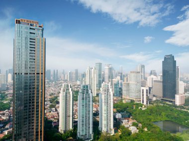 JAKARTA - Indonesia. August 08, 2022: Beautiful aerial view of highrise buildings with blue sky background in Jakarta city