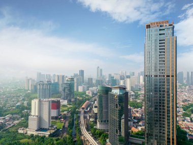 JAKARTA - Indonesia. August 08, 2022: Drone view of highrise buildings with blue sky background in Jakarta city