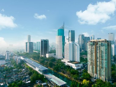 JAKARTA - Indonesia. August 15, 2022: Aerial view of Sudirman train station near high rise buildings in Jakarta city at morning time