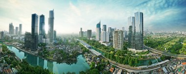 JAKARTA - Indonesia. August 15, 2022: Beautiful panoramic view of Jakarta cityscape with residential rooftop and highrise at morning time