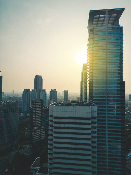 JAKARTA - Indonesia. August 29, 2022: Aerial view of high rise with sunrise background in the Jakarta downtown
