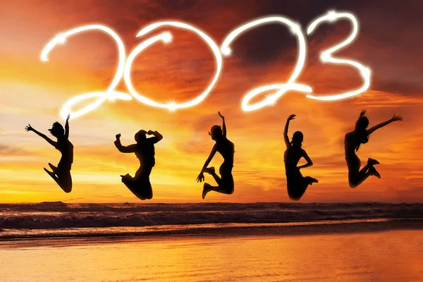 Group Silhouette Young Women Jumping Together Beach While Celebrating New — ストック写真