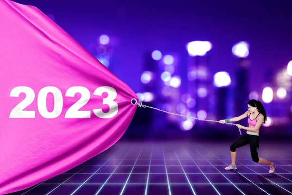 Indian Woman Wearing Sportswear While Pulling 2023 Number Banner Sparkling — Stock Photo, Image