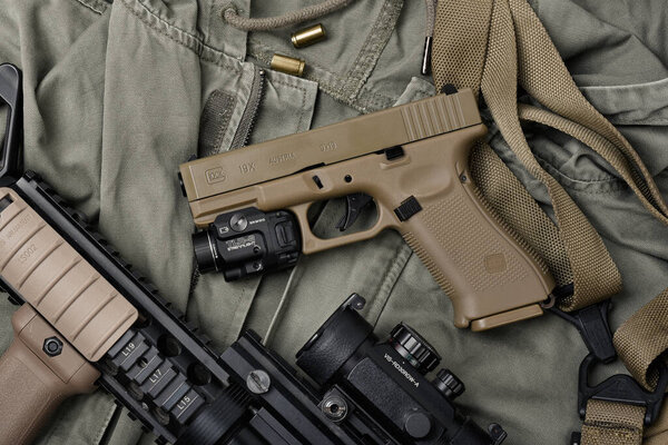 BANGKOK, THAILAND - April 3, 2022 : Glock 19X model with Streamlight trl8 tactical flashlight, Glock 19x is polymer 9mm pistol and popular handgun.