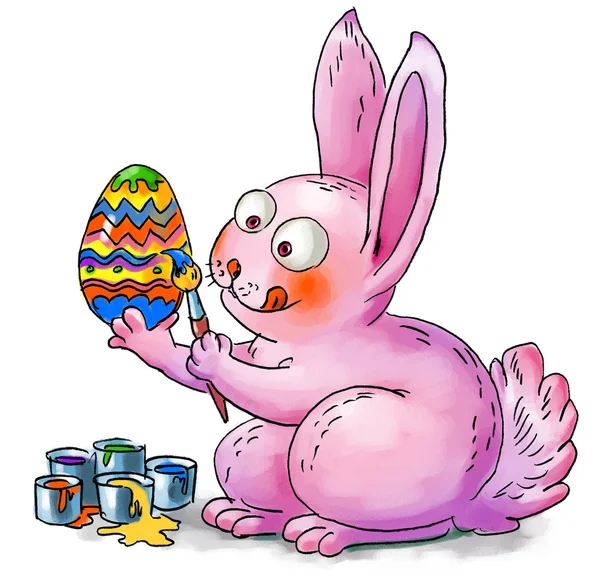 Пасхальный кролик украшает яйца — стоковое фото